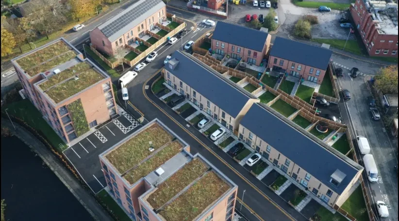 Modern housing development in Manchester showing high density residential properties suitable for retrofit upgrades under ECO4, SHDF and GBIS schemes